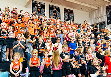 Group of spirited elementary students in the school gym